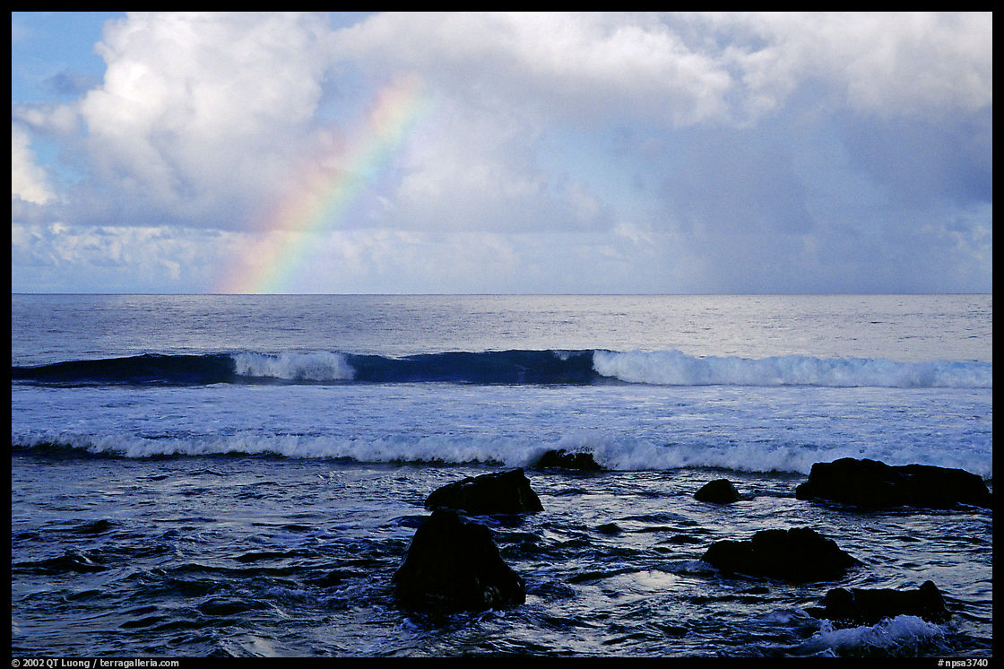 Rainbow and boulders, Siu Point, Tau Island. National Park of American Samoa