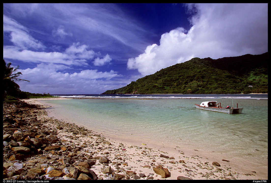 Fishing boat in Vatia Bay, mid-day, Tutuila Island. National Park of American Samoa