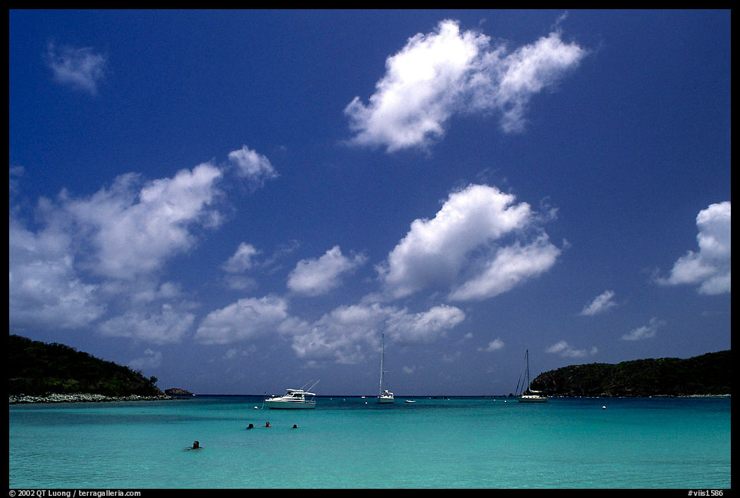 Saltpond bay beach with swimmers and boats. Virgin Islands National Park