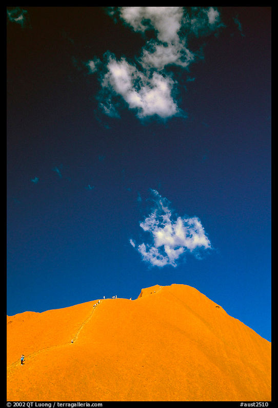 Hikers ascend Ayers Rock. Uluru-Kata Tjuta National Park, Northern Territories, Australia