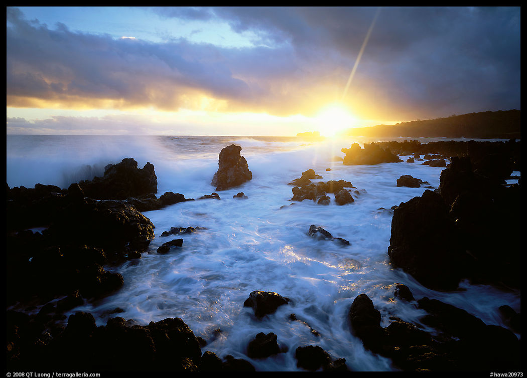 Sun and surf over rugged rocks, Kenae Peninsula. Maui, Hawaii, USA