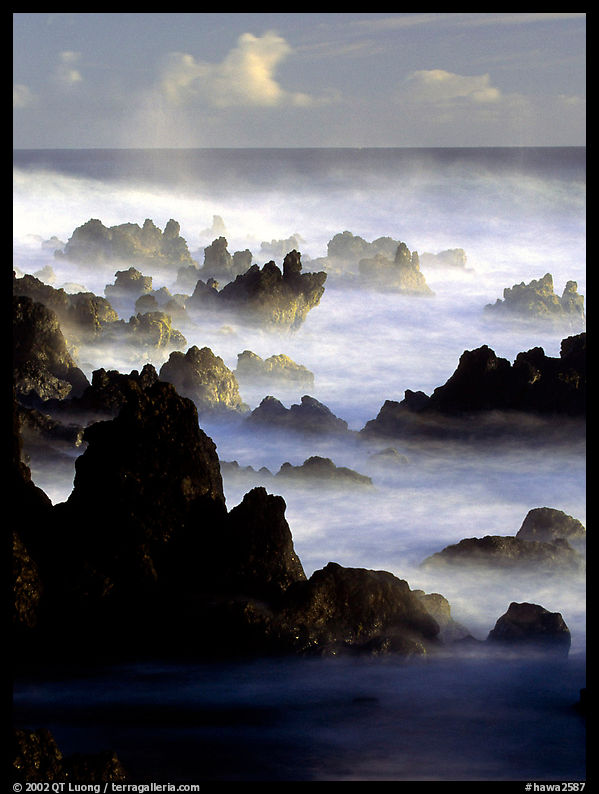 Rocks and waves at sunrise, Keanae Peninsula. Maui, Hawaii, USA
