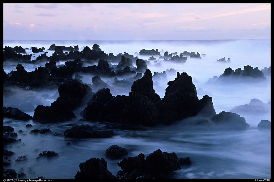Volcanic rocks and waves at sunrise, Keanae Peninsula. Maui, Hawaii, USA