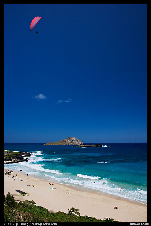 Makapuu Beach with paraglider above. Oahu island, Hawaii, USA