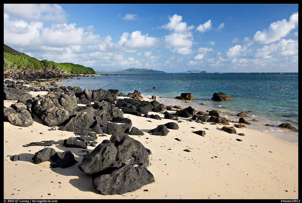 Volcanic rocks and beach, near Makai research pier,  early morning. Oahu island, Hawaii, USA