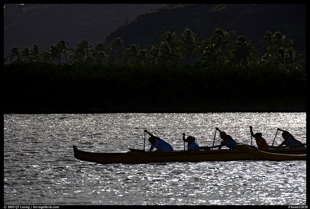 Backlit outrigger canoe, Maunalua Bay, late afternoon. Oahu island, Hawaii, USA