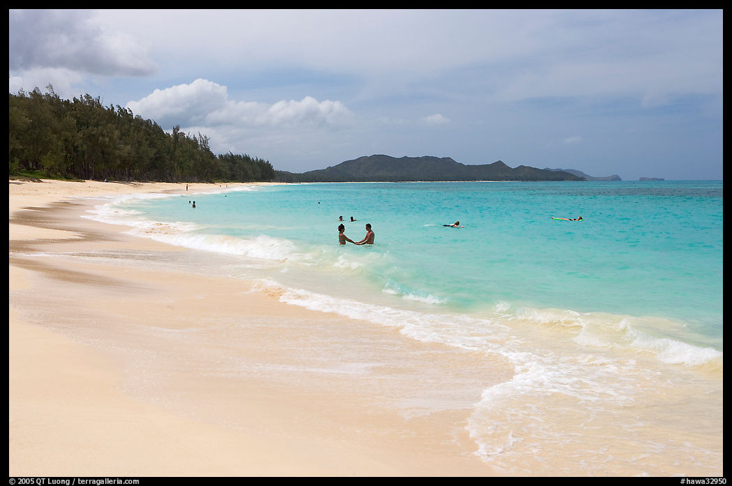 Couple and other bathers in the water, Waimanalo Beach. Oahu island, Hawaii, USA