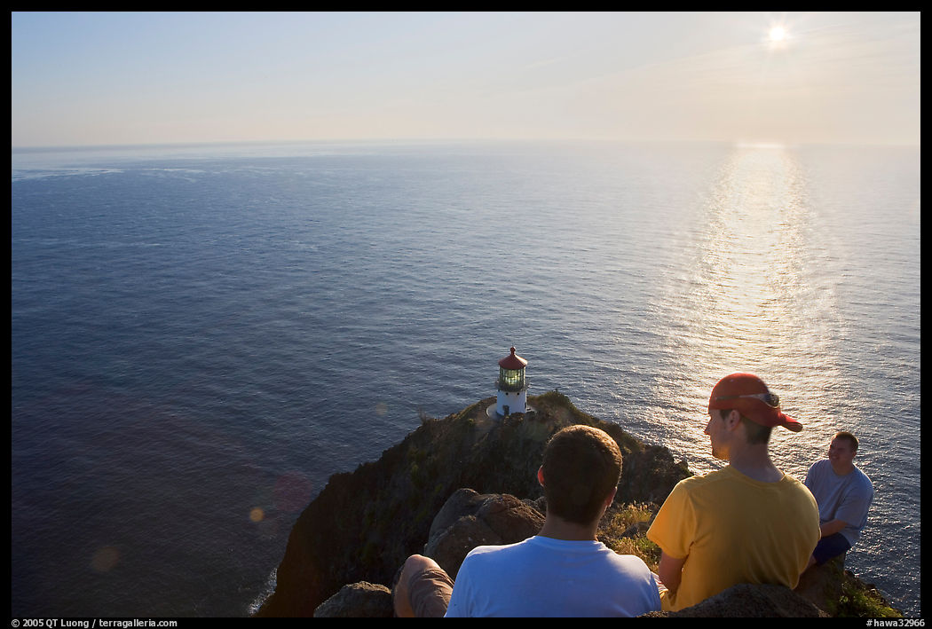 Men above the Makapuu head ligthouse, early morning. Oahu island, Hawaii, USA