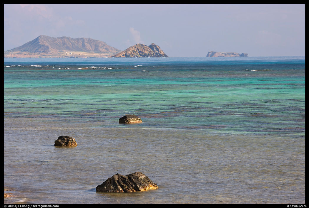 Rocks and turquoise waters near Makai research pier. Oahu island, Hawaii, USA