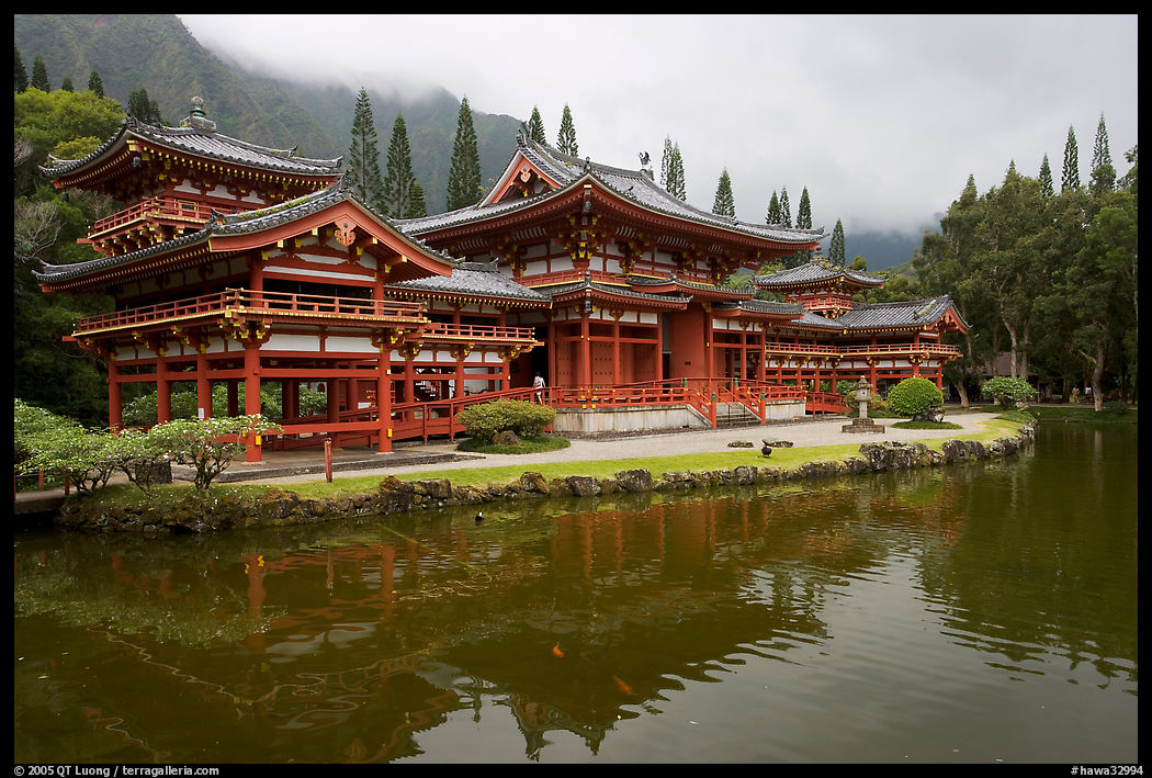 Byodo-In temple reflected in pond on a cloudy day. Oahu island, Hawaii, USA