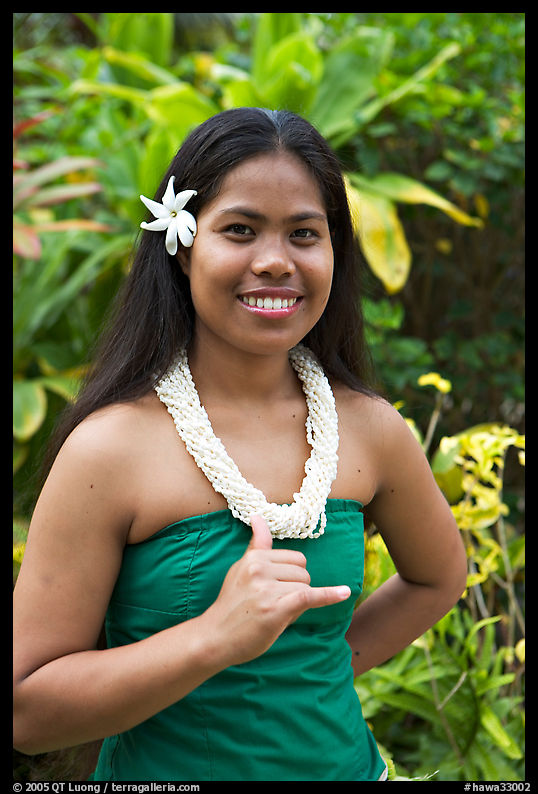 Tahitian woman making the traditional welcome gesture. Polynesian Cultural Center, Oahu island, Hawaii, USA