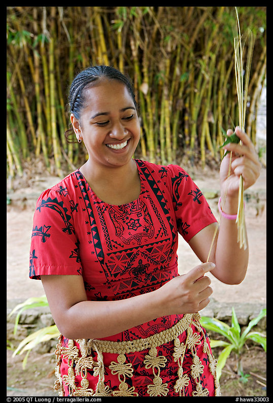 Tonga woman showing how to make cloth out of Mulberry bark. Polynesian Cultural Center, Oahu island, Hawaii, USA
