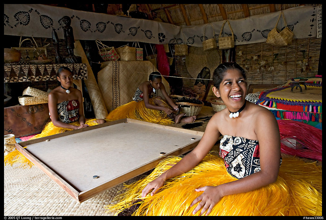 Fiji women sitting at a traditional pool table in vale ni bose (meeting) house. Polynesian Cultural Center, Oahu island, Hawaii, USA