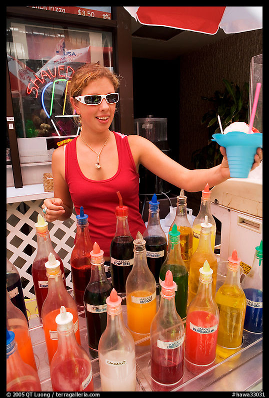 Woman handing out a cup of shave ice. Waikiki, Honolulu, Oahu island, Hawaii, USA