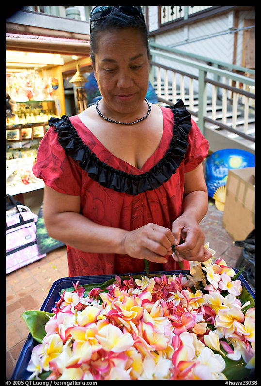 Woman preparing a fresh flower lei, International Marketplace. Waikiki, Honolulu, Oahu island, Hawaii, USA