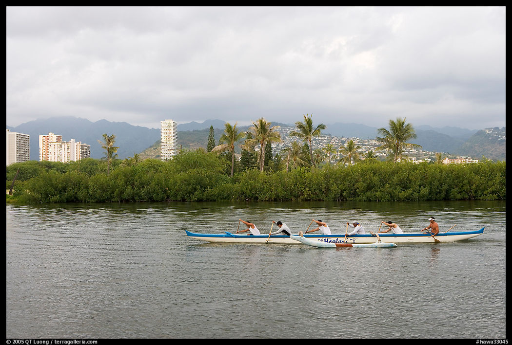 Outrigger canoe along the Ala Wai Canal. Waikiki, Honolulu, Oahu island, Hawaii, USA