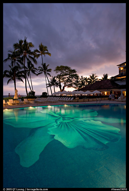 Swimming pool at sunset, Halekulani hotel. Waikiki, Honolulu, Oahu island, Hawaii, USA