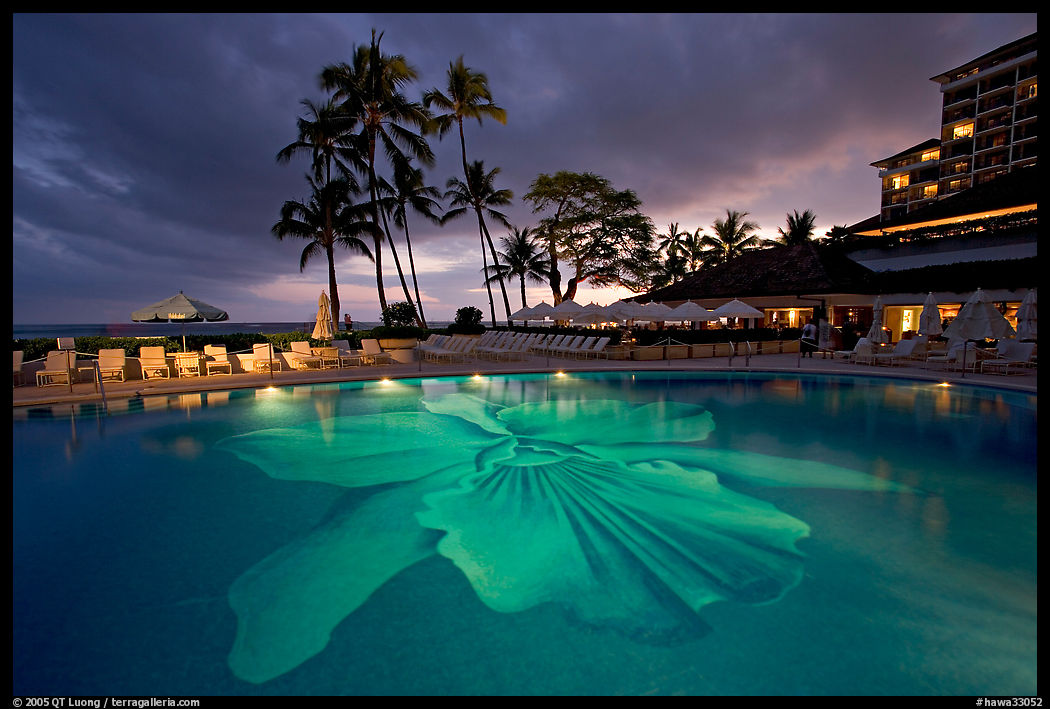 Swimming pool at sunset, Halekulani hotel. Waikiki, Honolulu, Oahu island, Hawaii, USA