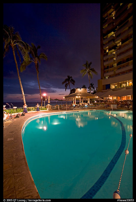 Swimming pool at night, with dance performance, Sheraton hotel. Waikiki, Honolulu, Oahu island, Hawaii, USA