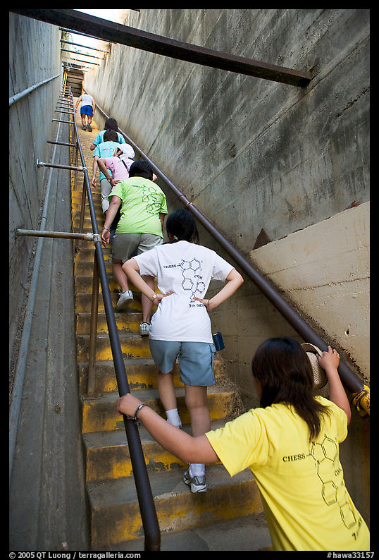 Women climbing a staircase on the Diamond Head summit trail. Oahu island, Hawaii, USA