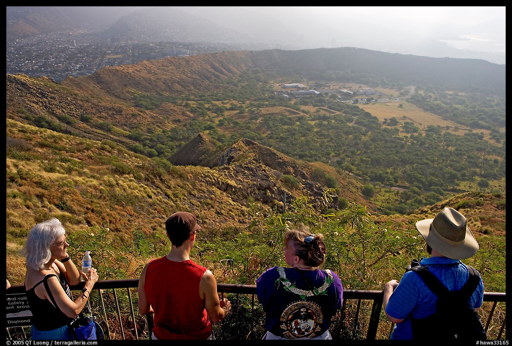 Visitors look at the  Diamond Head crater, early morning. Oahu island, Hawaii, USA