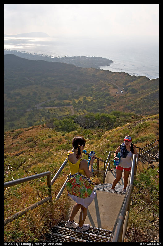 Visitors take a photo on the last steps of the Diamond Head crater summit trail. Oahu island, Hawaii, USA