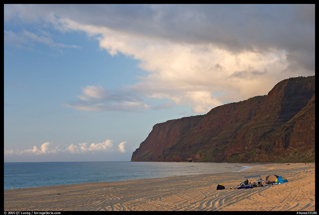 Campers and tire tracks in the sand, Polihale Beach, sunset. Kauai island, Hawaii, USA