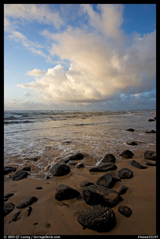 Boulders, beach and clouds, Lydgate Park, sunrise. Kauai island, Hawaii, USA