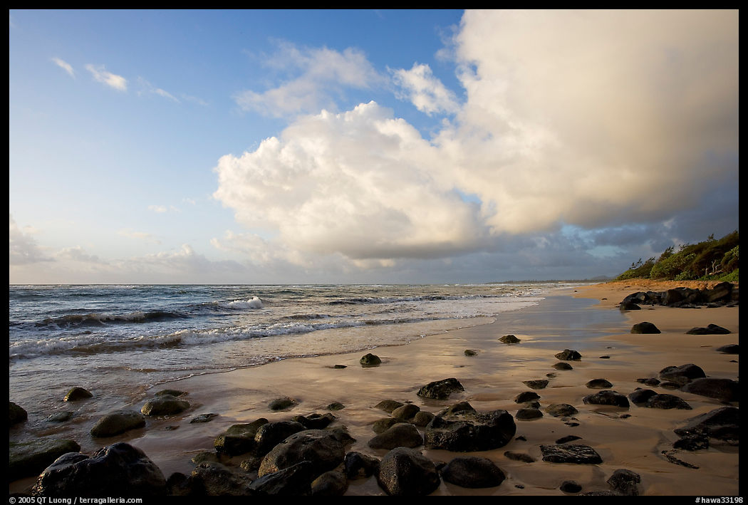 Boulders, beach and clouds, Lydgate Park, sunrise. Kauai island, Hawaii, USA