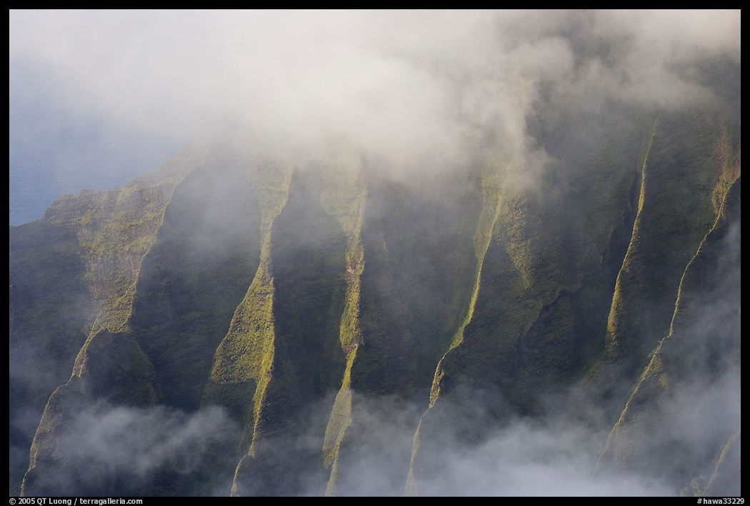 Fluted ridges seen through mist, Kalalau lookout, late afternoon. Kauai island, Hawaii, USA