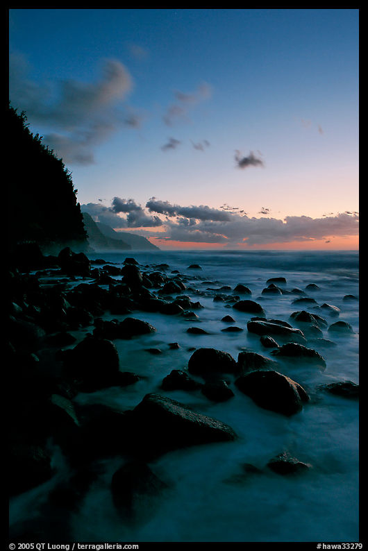 Boulders and misty surf from Kee Beach, dusk. Kauai island, Hawaii, USA