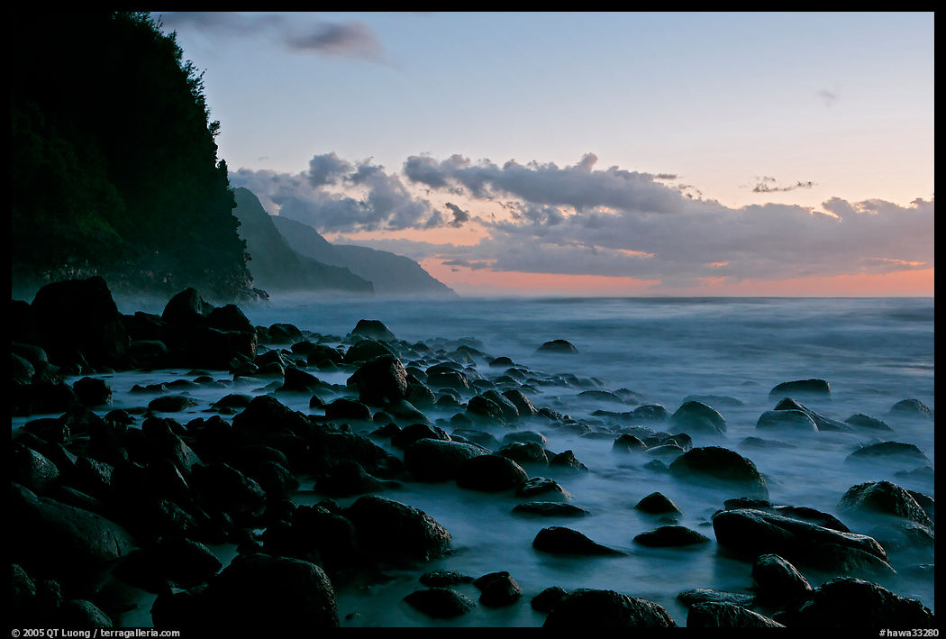 Boulders, surf, and Na Pali Coast, Kee Beach, dusk. Kauai island, Hawaii, USA