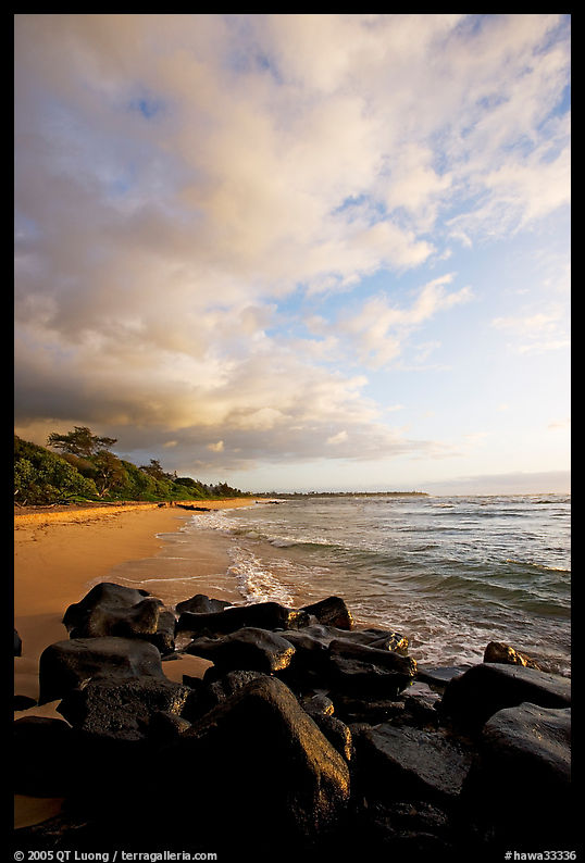 Boulders and beach, Lydgate Park, sunrise. Kauai island, Hawaii, USA