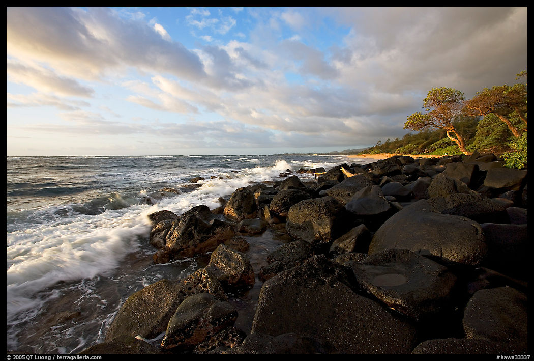 Boulders and coastline, Lydgate Park, sunrise. Kauai island, Hawaii, USA