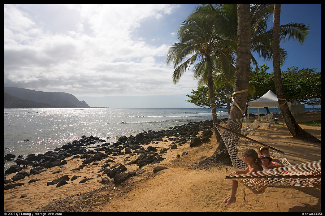 Family on Hammock, Puu Poa Beach. North shore, Kauai island, Hawaii, USA