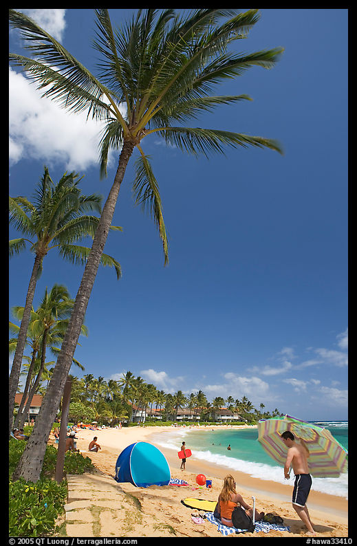 Couple and tent, Sheraton Beach, mid-day. Kauai island, Hawaii, USA