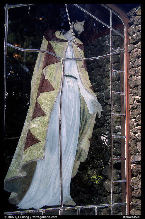 A stained glass with Jesus in traditional hawaiian robe, Palapala Hoomau church. Maui, Hawaii, USA