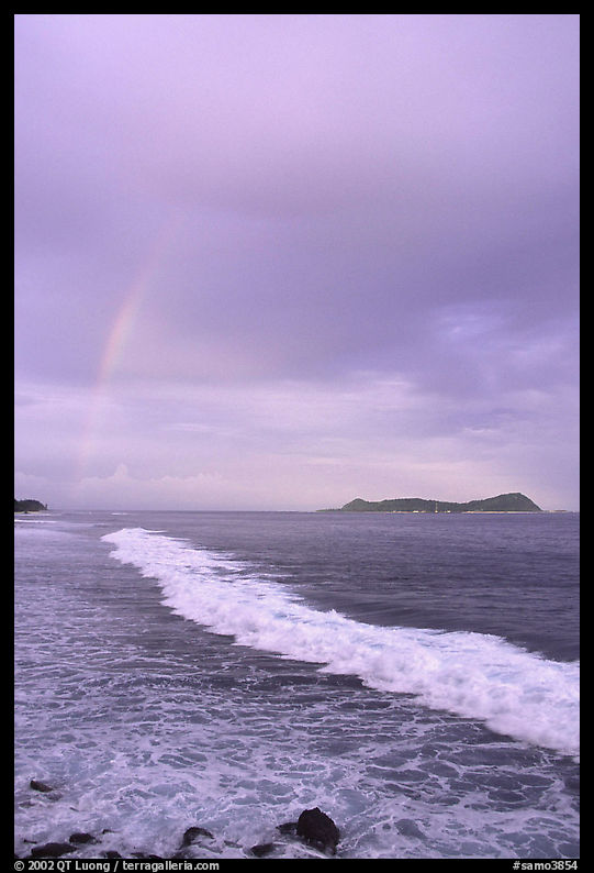Rainbow at sunset, wave, and Aunuu island. Aunuu Island, American Samoa