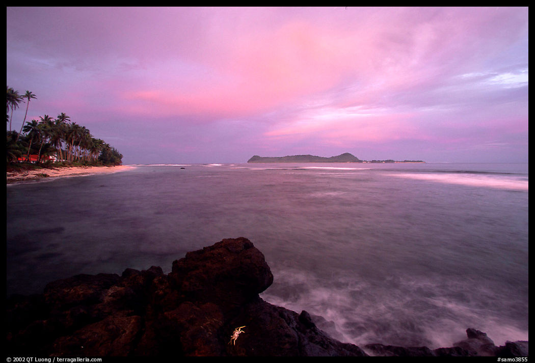 Sunset over Aunuu island with crab on basalt rock. Aunuu Island, American Samoa