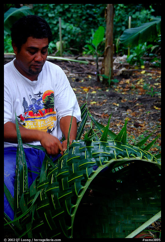 Villager weaving a basket out of a single palm leaf. Tutuila, American Samoa