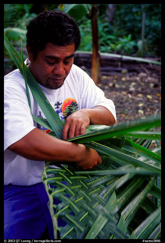 Villager weaving a basket out of a single palm leaf. Tutuila, American Samoa