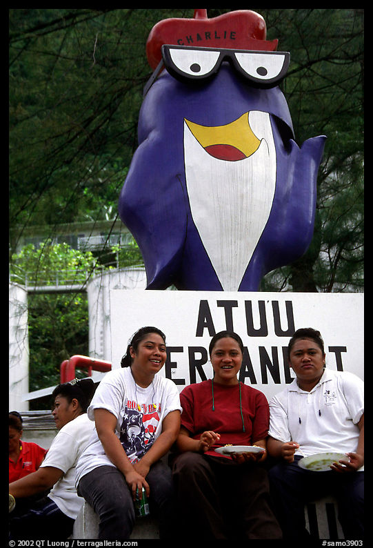 Women in front of statue of Charlie the Tuna. Pago Pago, Tutuila, American Samoa