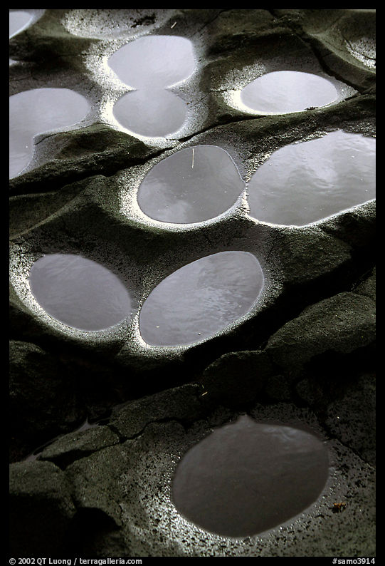 Ancient grinding stones holes (foaga) near Leone. Tutuila, American Samoa