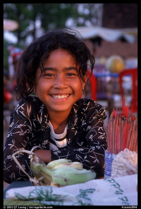 Young incense vendor. Phnom Penh, Cambodia