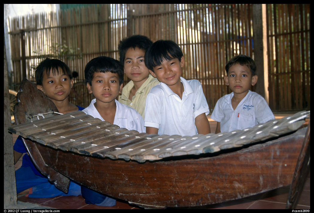 Boys with a traditional musical instrument. Phnom Penh, Cambodia