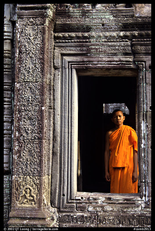 Buddhist monk in doorway, the Bayon. Angkor, Cambodia