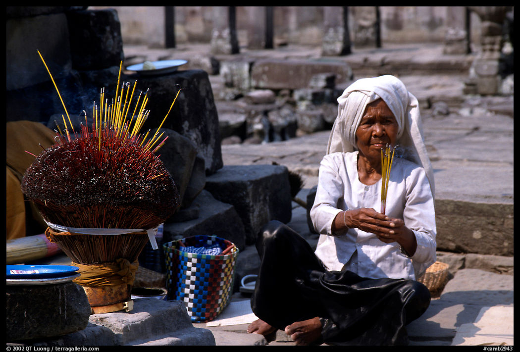 Incence vendor wearing the traditional headcloth outside of the Bayon. Angkor, Cambodia