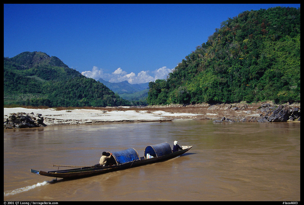 Narrow live-in boat. Mekong river, Laos