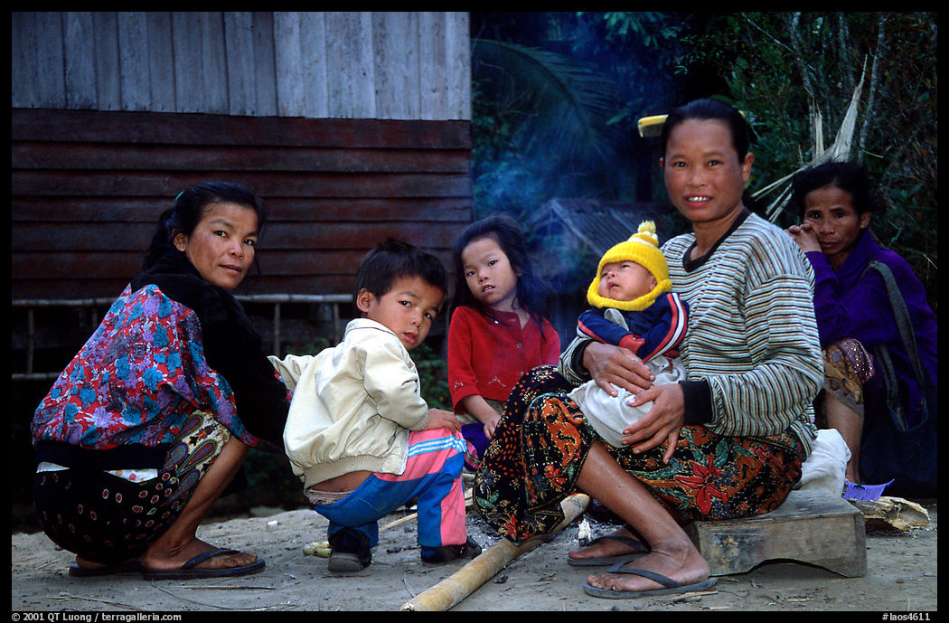 Group of women and children in a small hamlet. Mekong river, Laos