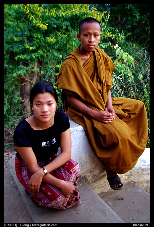 Buddhist novice monk and his sister. Luang Prabang, Laos